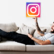 man on couch with instagram icon