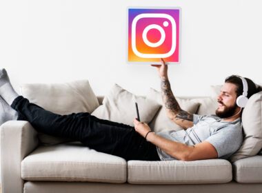 man on couch with instagram icon